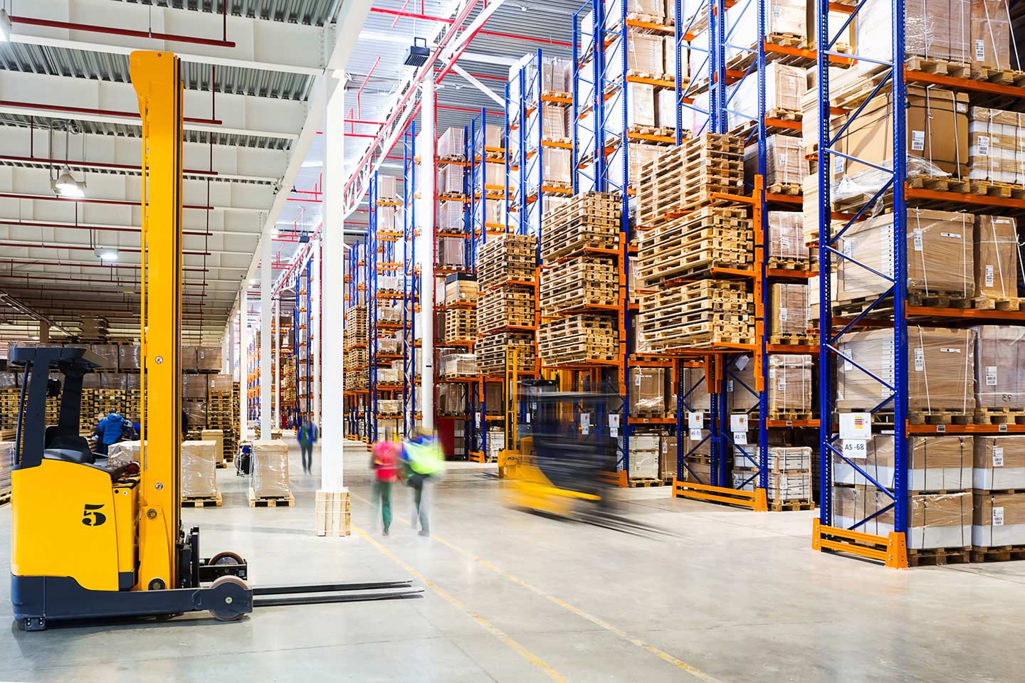Stocking shelves in large warehouse