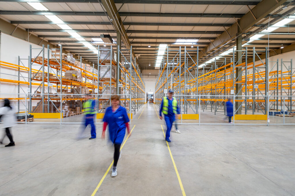workers walking in warehouse