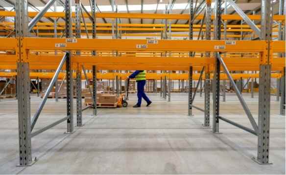 warehouse aisles with orange shelving
