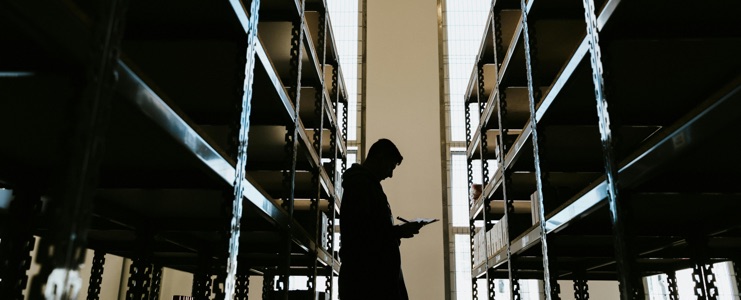 silouhette of a man in a warehouse